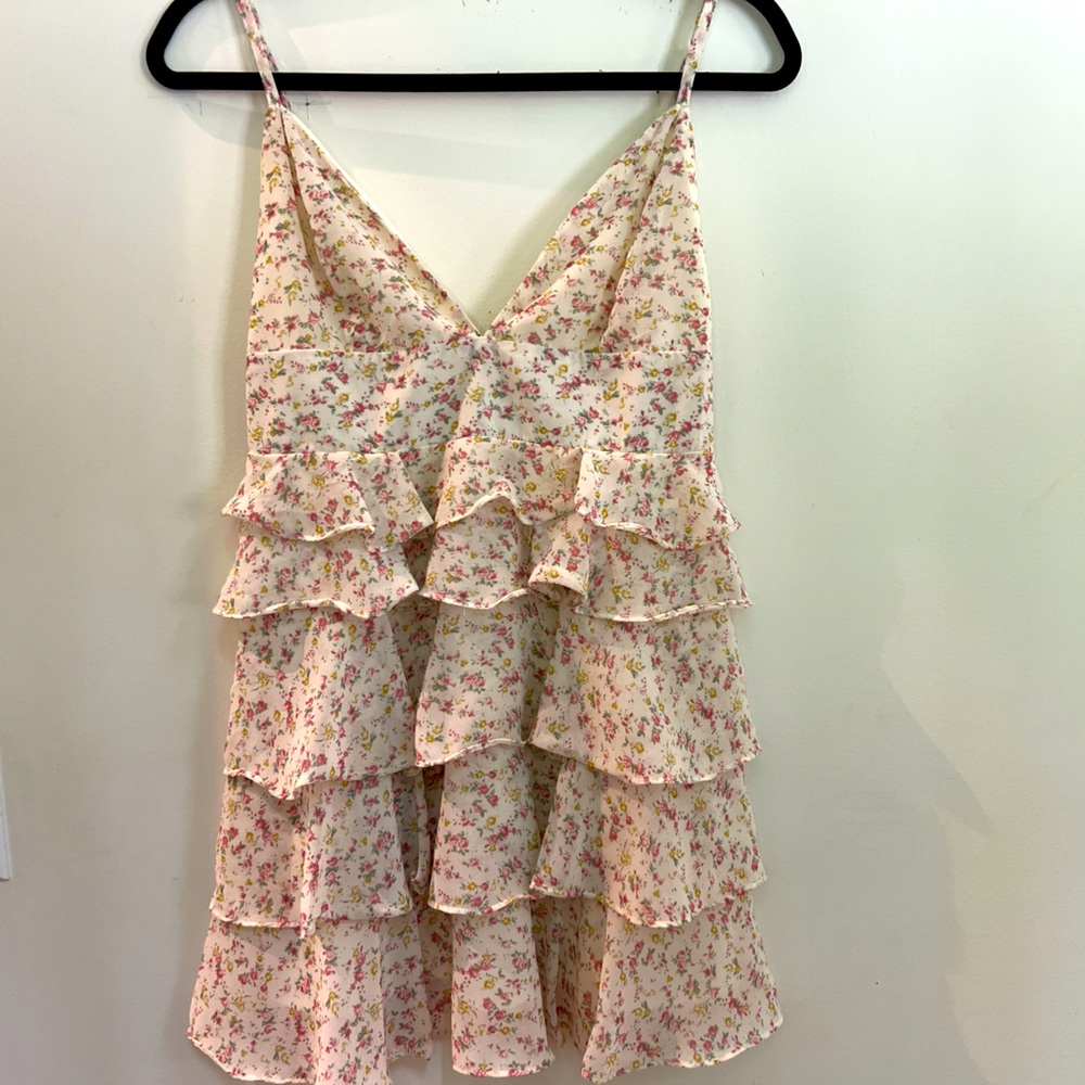 New cocktail/ summer dress never worn. Adjustable straps. Ivory color not white.